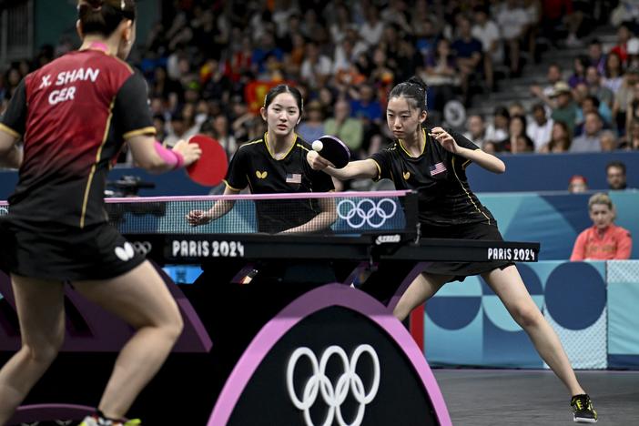 Rachel Sung and Amy Wang of the U.S. women's table tennis team take on Germany during the 2024 Olympic Games in Paris. 