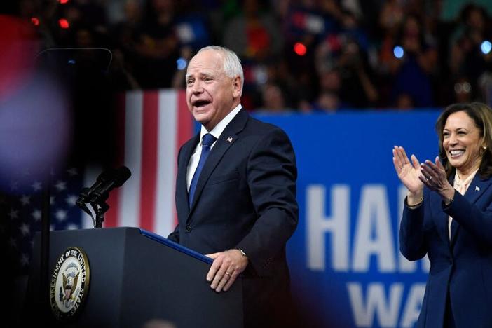 Vice President and Democratic presidential nominee Kamala Harris applauds as her running mate, Minnesota Gov. Tim Walz, speaks at Temple University's Liacouras Center in Philadelphia on Tuesday. 