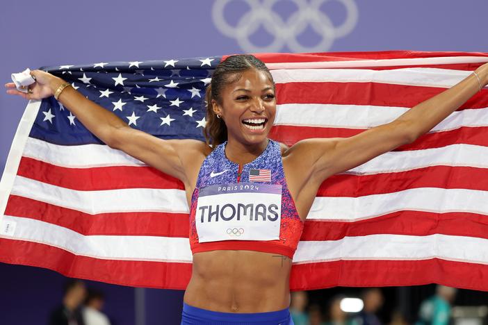 Sprinter Gabby Thomas of the U.S. celebrates winning the gold medal after competing in the women's 200m final on Tuesday at the Paris Olympic Games at Stade de France.