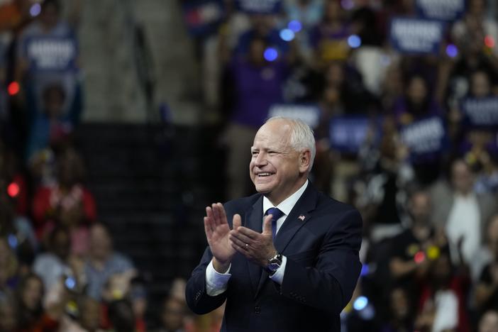 Minnesota Gov. Tim Walz, pictured at a campaign rally in Philadelphia on Tuesday, is getting attention for a law he signed last year requiring public schools to provide free period products.