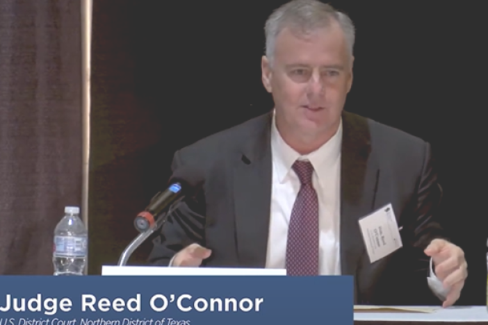 U.S. Federal Judge Reed O'Connor has been a longtime active member of the Federalist Society. In 2018, he spoke on a panel at the annual Texas Chapters Conference.<br>