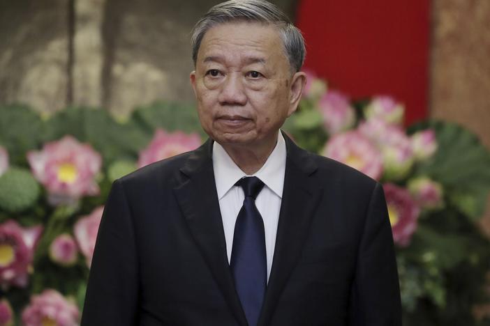 Vietnamese President To Lam is shown waiting for the arrival of Japanese former Prime Minister Yoshihide Suga at the Presidential Palace in Hanoi, Vietnam, on July 25, 2024.