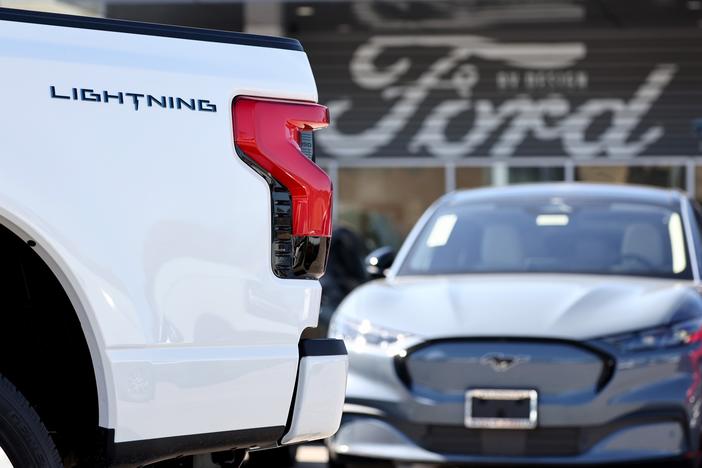 A Ford F-150 Lightning electric pickup truck is displayed for sale at a Ford dealership on Aug. 21 in Glendale, Calif. Ford says it is upending its electric vehicle strategy for North American vehicles to focus on hybrids, citing consumers' demands for affordability and longer ranges.