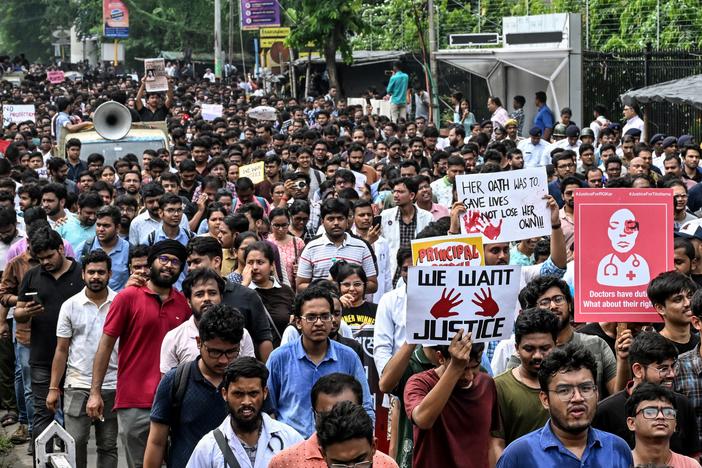 Medical professionals and students take part in a protest rally against the rape and murder of a doctor in Kolkata on Aug. 21. India's Supreme Court on Aug. 20 ordered a national task force to examine how to bolster security for healthcare workers after the "horrific" rape and murder of a doctor sparked medical strikes and furious protests. 