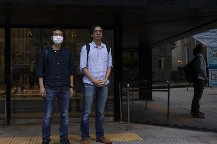 Former chief editor Chung Pui-kuen, right, and former acting editor Patrick Lam, left, of the now-defunct independent media outlet Stand News leave the court on the last day of the publication's sedition trial closing statements in Hong Kong on June 28, 2023.