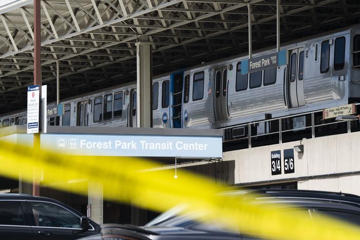 Yellow tape blocks off the parking lot of the Forest Park Blue Line train station in Forest Park, Ill., after four people were fatally shot on the train early Monday, Sept. 2, 2024. 