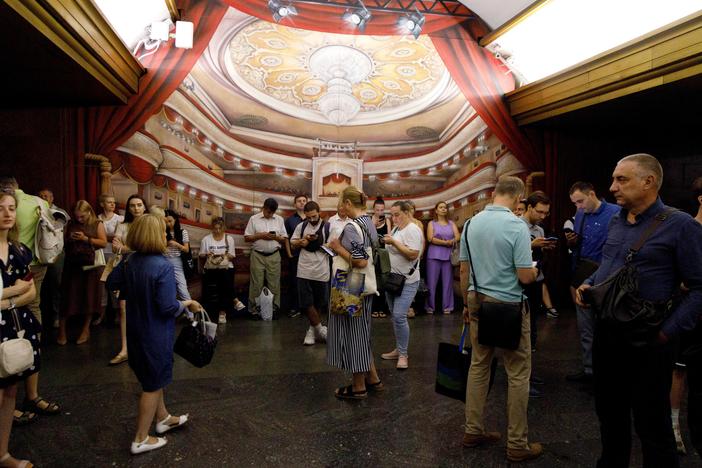 People wait out an air raid alarm at the Teatralna metro station during the massive Russian drone and missile attack in Kyiv, Ukraine, on Aug. 26.