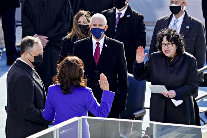 Supreme Court Justice Sonia Sotomayor (right) administers the oath of office to incoming Vice President Kamala Harris in front of the U.S. Capitol on Jan. 20, 2021, as outgoing Vice President Mike Pence (wearing blue mask) watches.