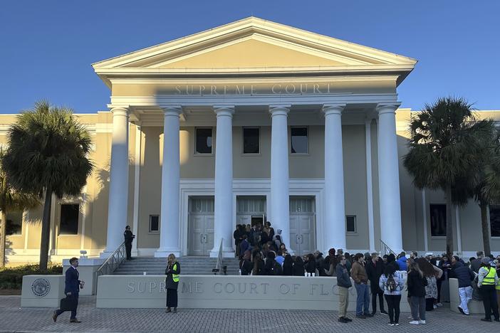 People gather outside the Florida Supreme Court in Tallahassee earlier this year. Voting rights groups challenging the state’s congressional map are counting on the court to reinstate a district that gave Black voters in the northern part of the state the opportunity to elect their candidate of choice.