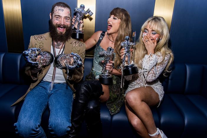 Post Malone, Taylor Swift and Sabrina Carpenter laugh backstage at the 2024 MTV Video Music Awards on Wednesday in Elmont, N.Y.