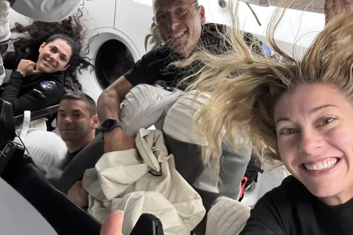 In this image posted by SpaceX following the first-ever commercial spacewalk by the Polaris Dawn crew, shows (L-to-R) mission specialist Sarah Gillis, commander Jared Isaacman, pilot Scott Poteet and mission specialist Anna Menon aboard a SpaceX Crew Dragon capsule.