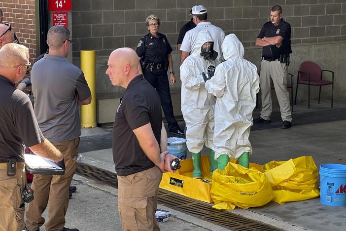 A hazmat crew from the National Guard's Civilian Support Team investigates after a suspicious package was delivered to election officials at the Missouri secretary of state's Jefferson City, Mo., office on Tuesday.