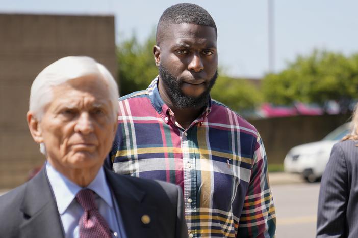 Emmitt Martin III, a former Memphis police officer (second from left) walks into federal court on Aug. 23 in Memphis, Tenn. Martin testified Tuesday that he punched a “helpless” Tyre Nichols.