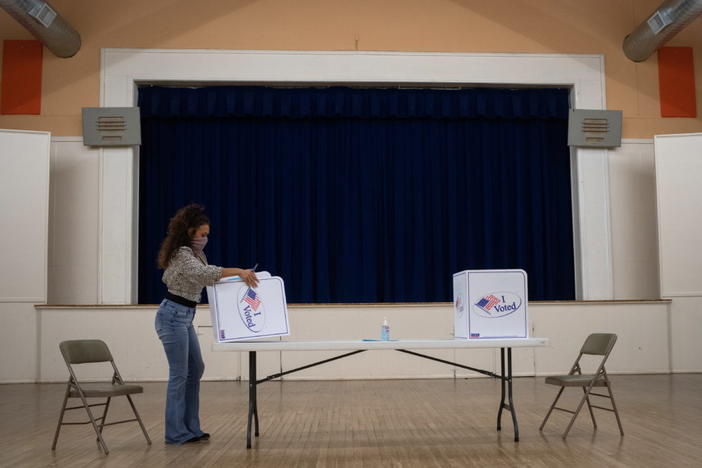 Presidio County election judge Lauren Martinez folds a booth after voting ended for the 2020 U.S. presidential election in Marfa, Texas, U.S., November 3, 2020. Photo by Adrees Latif/REUTERS