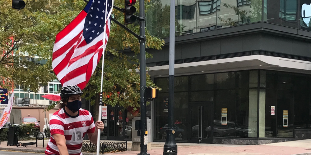 Biker Celebrates carrying an American flag