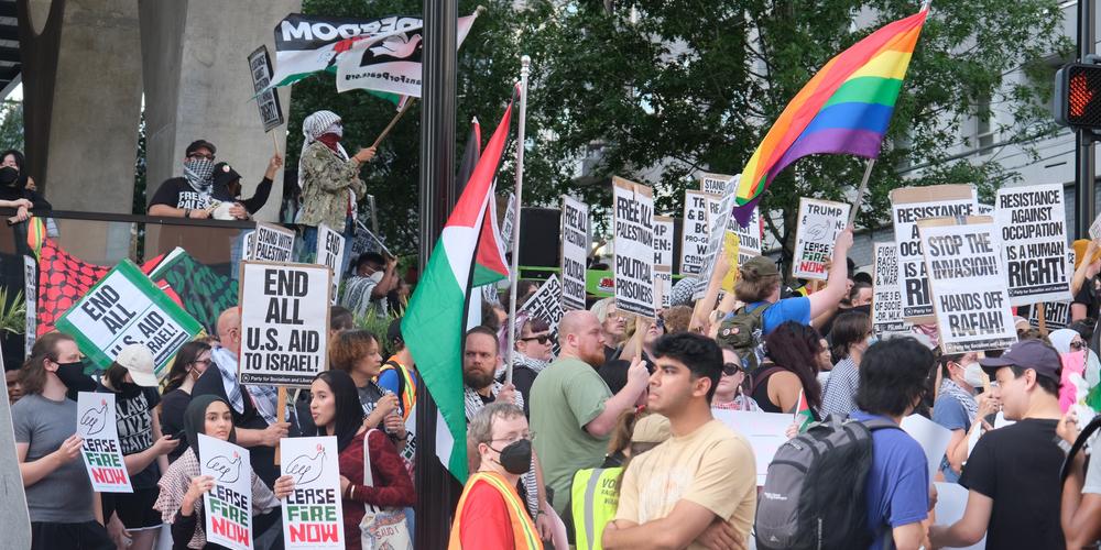 Protestors rally in support of Palestine ahead of the Biden Trump debate in midtown Atlanta on June 27, 2024.