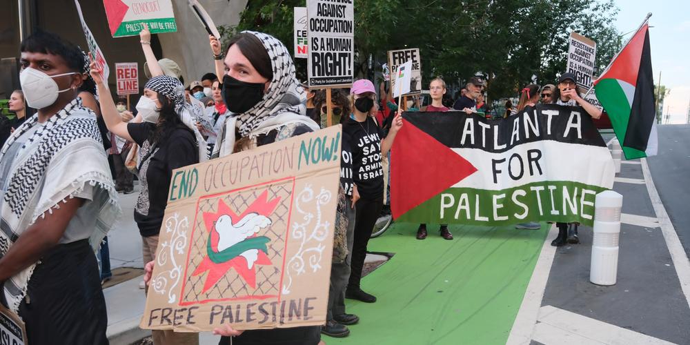Protestors in support of Palestine rally in Midtown Atlanta on June 27, 2024.