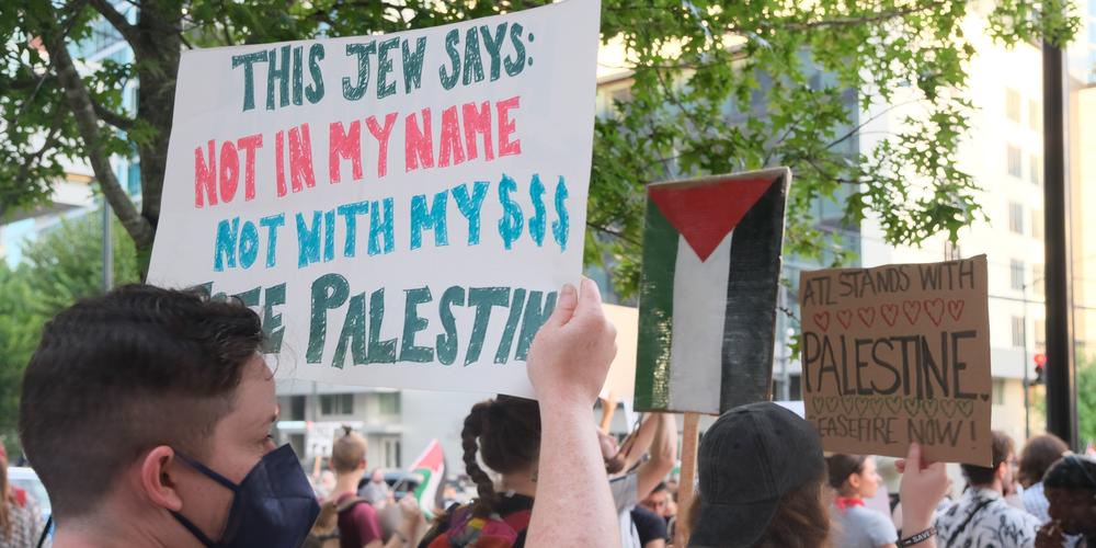 Protestors in support of Palestine rally in midtown Atlanta on June 27, 2024.