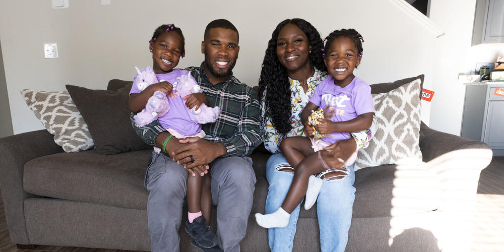 The Altidor family poses for a portrait.