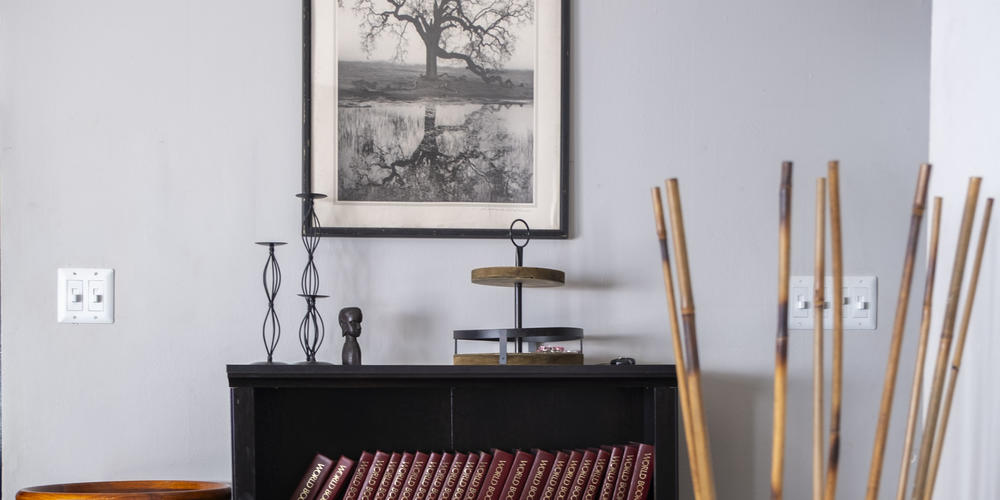 A bookshelf in Rahmaan James' new home.