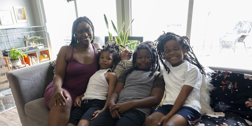 Rasheeda Rahmaan James's sons pose with her for a portrait.