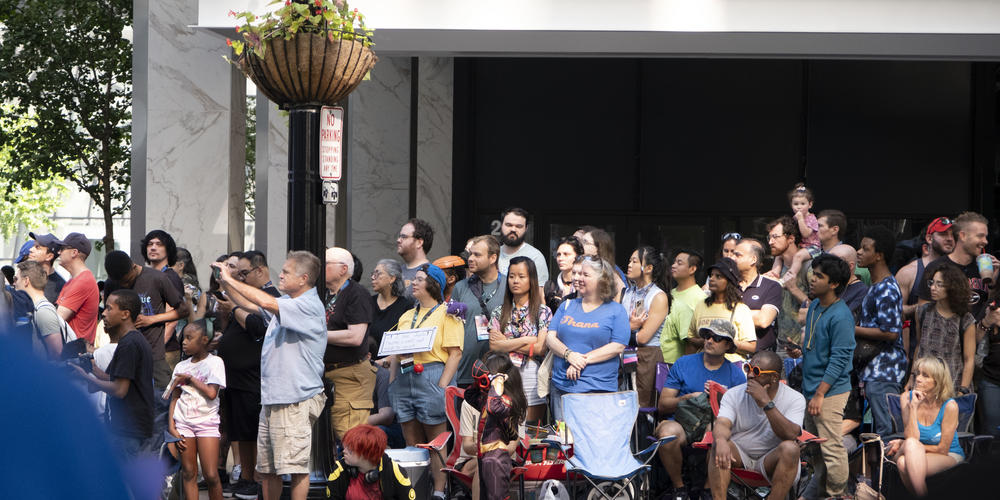 A crowd watches the parade at Dragon Con on Aug. 31, 2024.