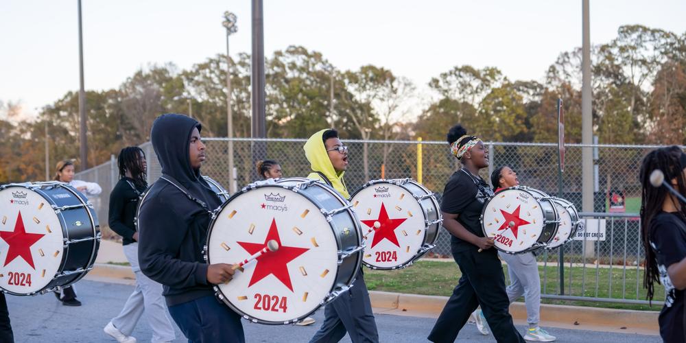 The Jonesboro High Majestic Marching Cardinals play their instruments during their final band practice before heading off to the Macy's Thanksgiving Day Parade.