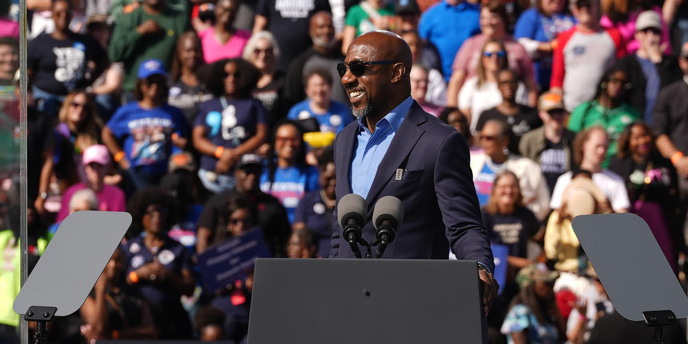 Sen. Raphael Warnock speaks at a rally for Vice President Kamala Harris outside the Atlanta Civic Center on Nov. 2, 2024.