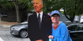 Woman next to cardboard cut out of Biden