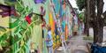 Atlanta Crossroads Mural Festival painter working on mural. (Isadora Pennington/Rough Draft Atlanta)