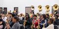 The Jonesboro High Majestic Marching Cardinals play their instruments during their final band practice before heading off to the Macy's Thanksgiving Day Parade.