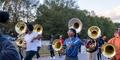 The Jonesboro High Majestic Marching Cardinals play their instruments during their final band practice before heading off to the Macy's Thanksgiving Day Parade.