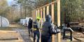 Participants work to build a shed for workshops at Phoenix Gardens.